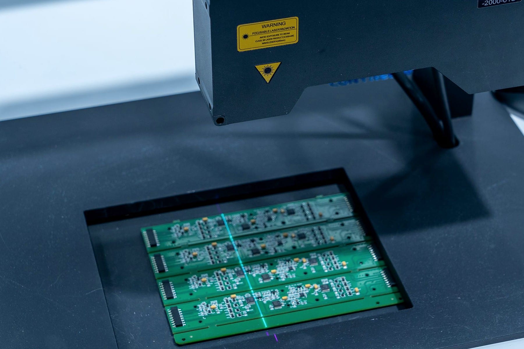 Automated optical inspection system scanning circuit boards on a production line